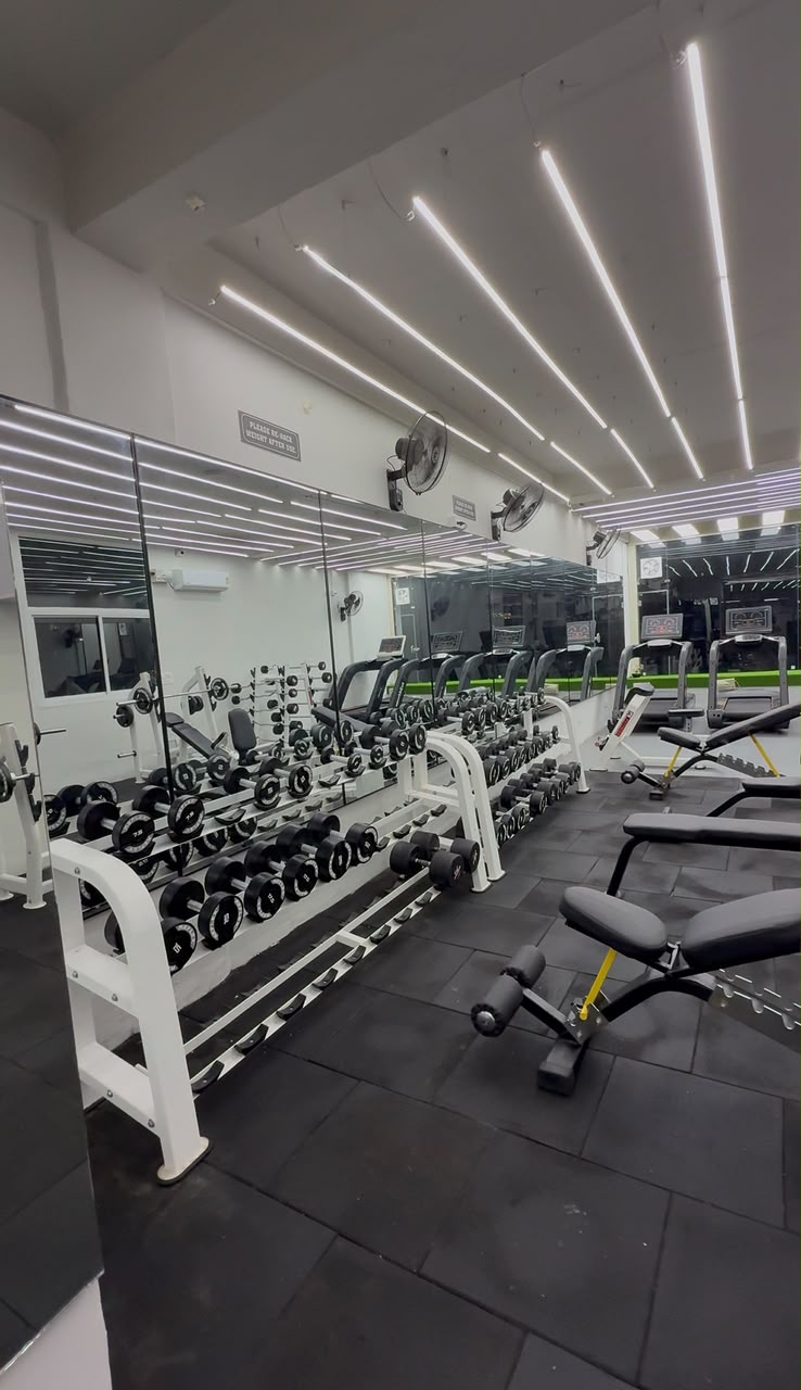 Real Revive Fitnes free-weight training floor in Dhakoli