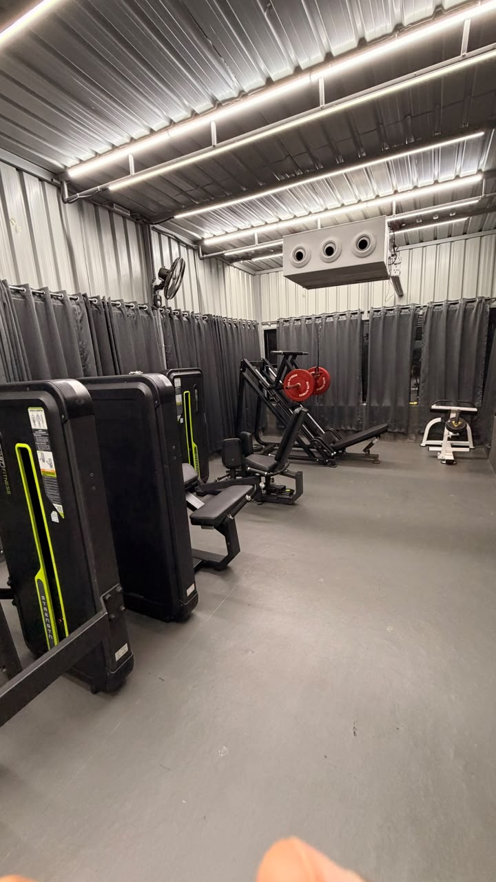 Plate-loaded strength equipment in the Revive Fitnes training zone